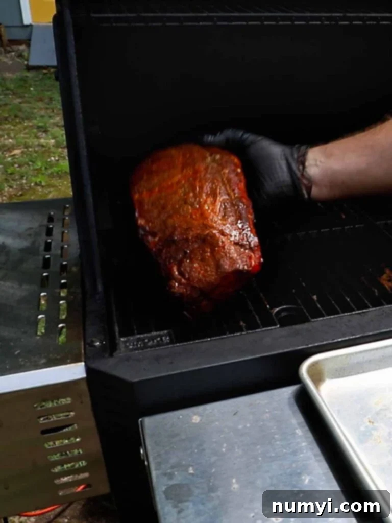 The Ultimate Smoked Baby Back Ribs 12 Doing the rib bend test to check for doneness.