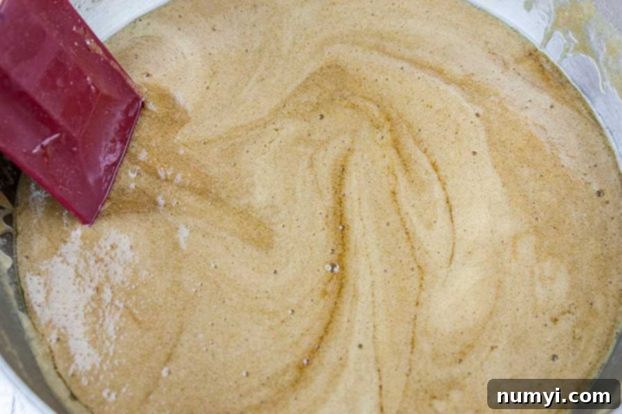 Dark brown sugar, light corn syrup, and butter melting in a saucepan for the praline coating.