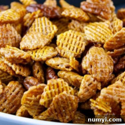 Praline Crunch Snack Mix in a white bowl.