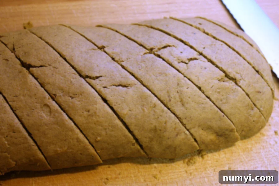 baked pumpkin biscotti sliced on a wooden board