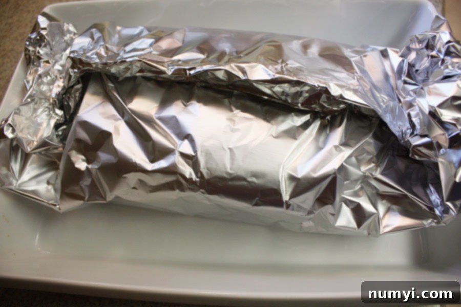 Corned Beef wrapped in aluminum foil, ready for the oven.