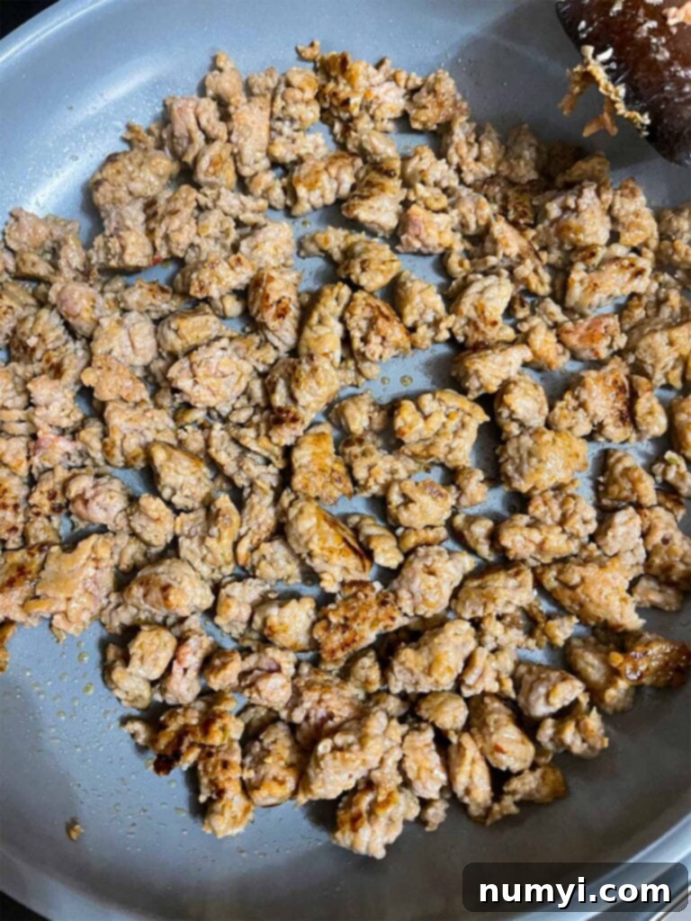 Italian sausage browned in a skillet.