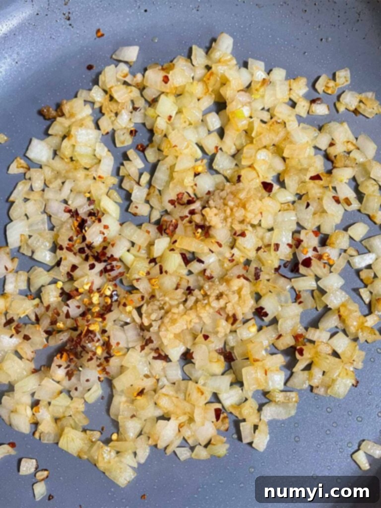 Onions sauteed in a skillet.