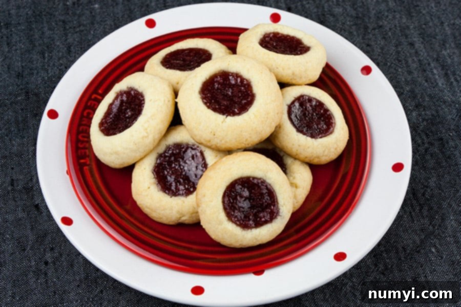 Homemade Jam Thumbprint Cookies 7 A soft, delicate, slightly crisp cookie base filled with sweet, tangy red raspberry jam! This easy Red Raspberry Thumbprint Cookie recipe is a Christmas tradition.