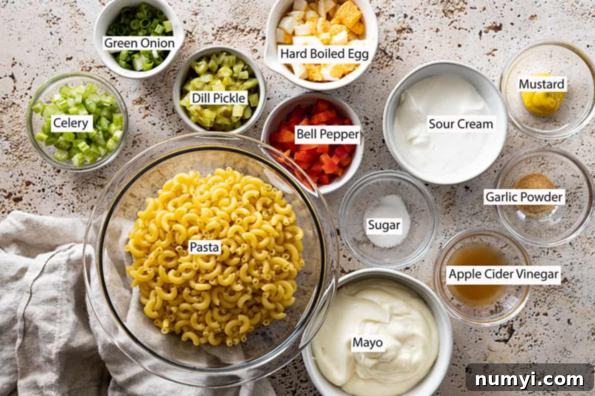 Ingredients: pasta, celery, green onion, bell pepper, hard boiled egg, sour cream, mustard, garlic powder, sugar, apple cider vinegar, and mayo.