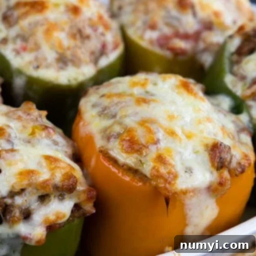 Classic Stuffed Bell Peppers 5 Stuffed bell peppers in a white baking dish.
