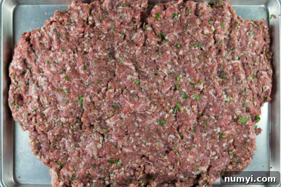 Authentic Homemade Fennel Italian Sausage Recipe 7 Mixed Italian sausage on a baking sheet, ready for stuffing.