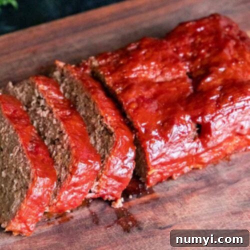 Smoky Meatloaf Perfection 13 Smoked meatloaf on a cutting board.