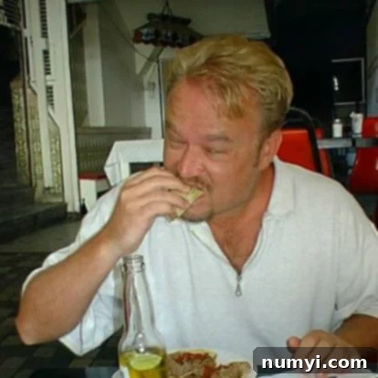 The author's husband enjoying street tacos in Tijuana, Mexico, years ago, illustrating the authentic inspiration behind the recipe.