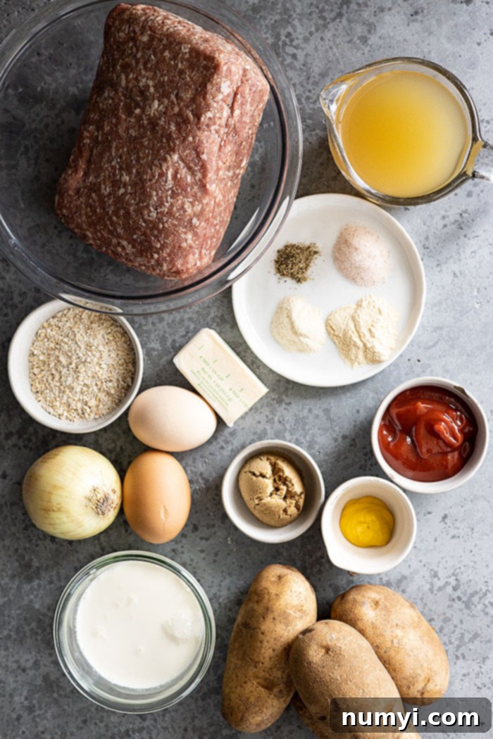 A flat lay of all the essential ingredients needed for this Instant Pot meal: ground beef, various seasonings, fresh potatoes, eggs, rich butter, and a flavorful sauce for the meatloaf glaze.