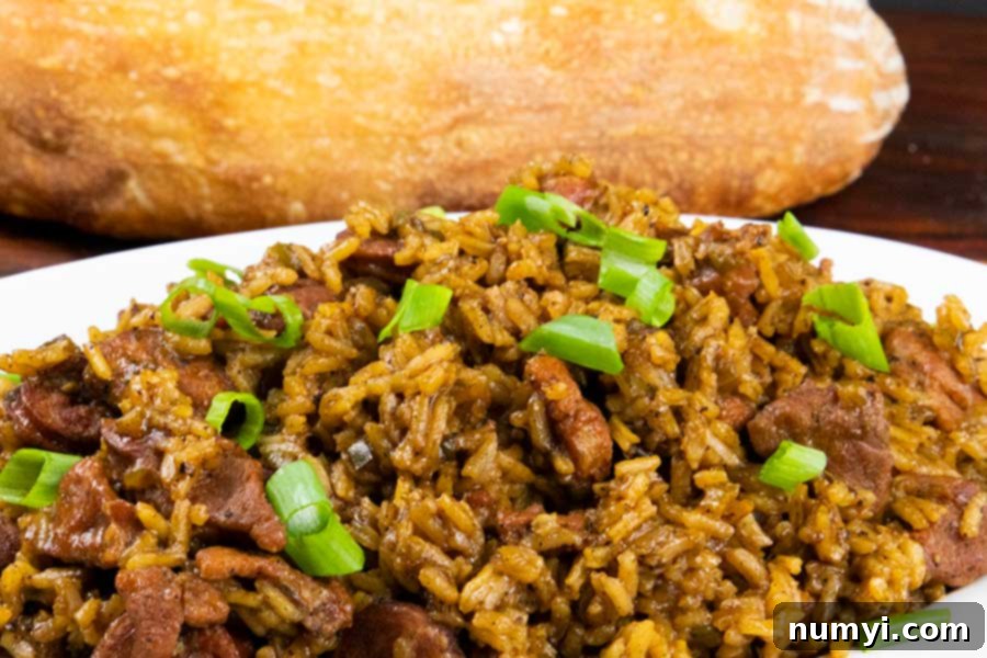 A vibrant and flavorful serving of authentic Cajun jambalaya, showcasing its rich texture and ingredients, perfect for a New Orleans-inspired meal. #jambalaya #cajun #food #recipes