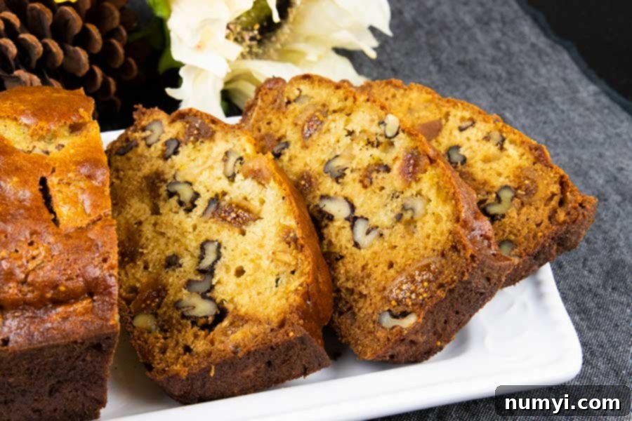 Beautifully sliced Walnut Fig Bread, revealing the succulent figs and crunchy walnuts within.