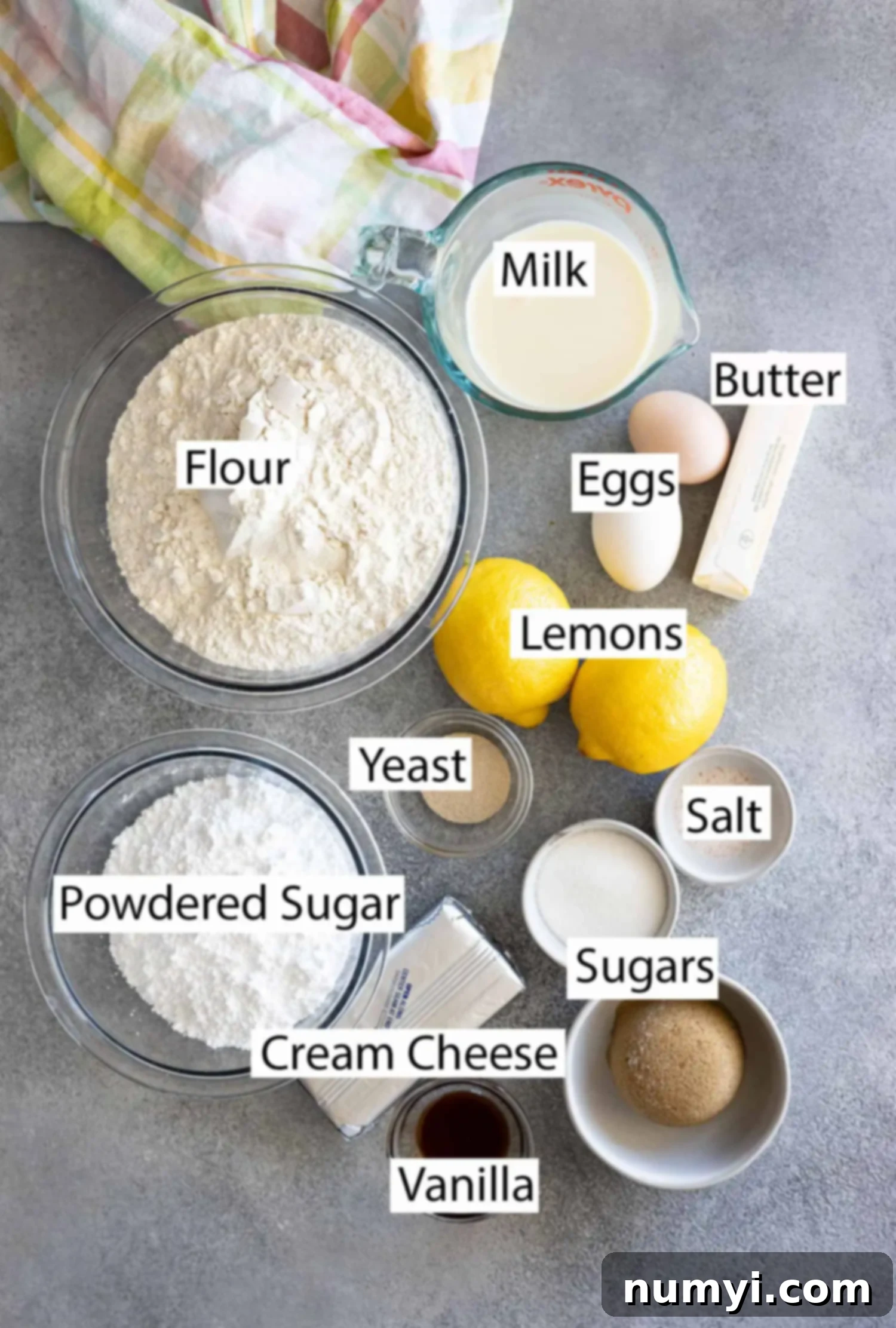 Ingredients: milk, butter, flour, eggs, lemons, yeast, salt, sugar, brown sugar, cream cheese, powdered sugar, and vanilla. 