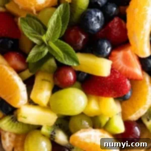 Close up of easy fruit salad. Fresh mint to garnish.