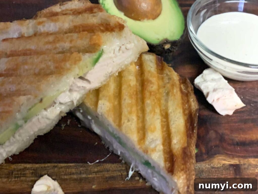 Smoked chicken panini on a cutting board