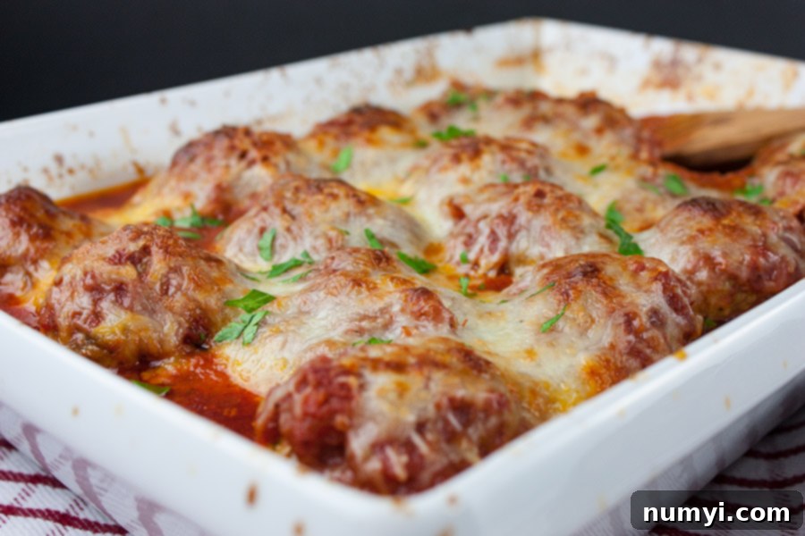 Easy Baked Parmesan Meatballs - One pan at it's best! Mouthwatering,tender, juicy, Italian meatballs smothered in goodness!