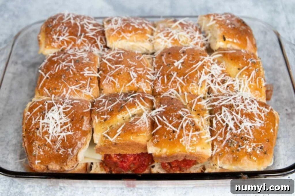 Assembled meatball sliders about to go into the oven.