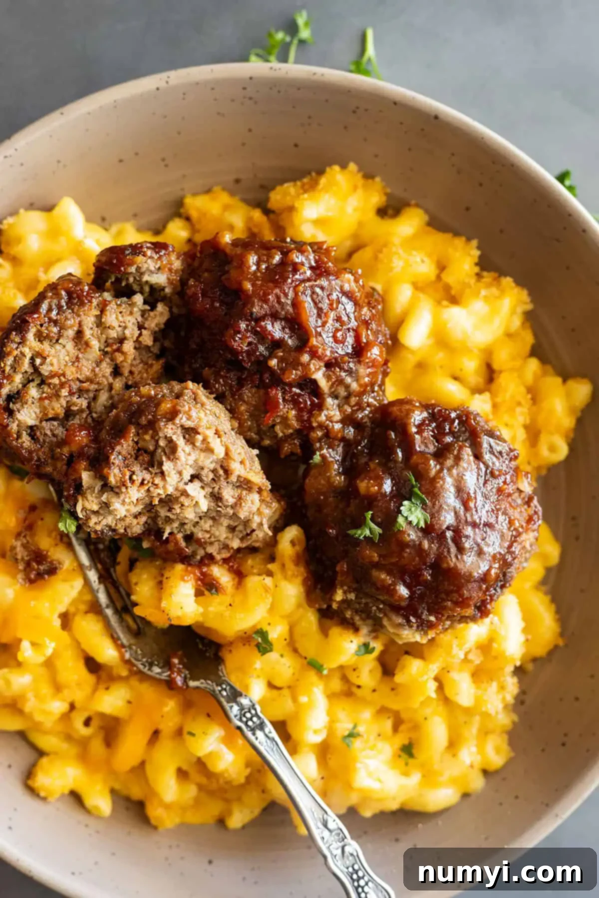 Simple BBQ Meatball Bliss 6 Appetizer-sized BBQ meatballs served with creamy mac and cheese, ready for a party or casual meal.