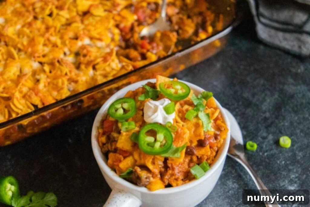 Frito Pie Casserole in a white bowl, ready to be enjoyed.