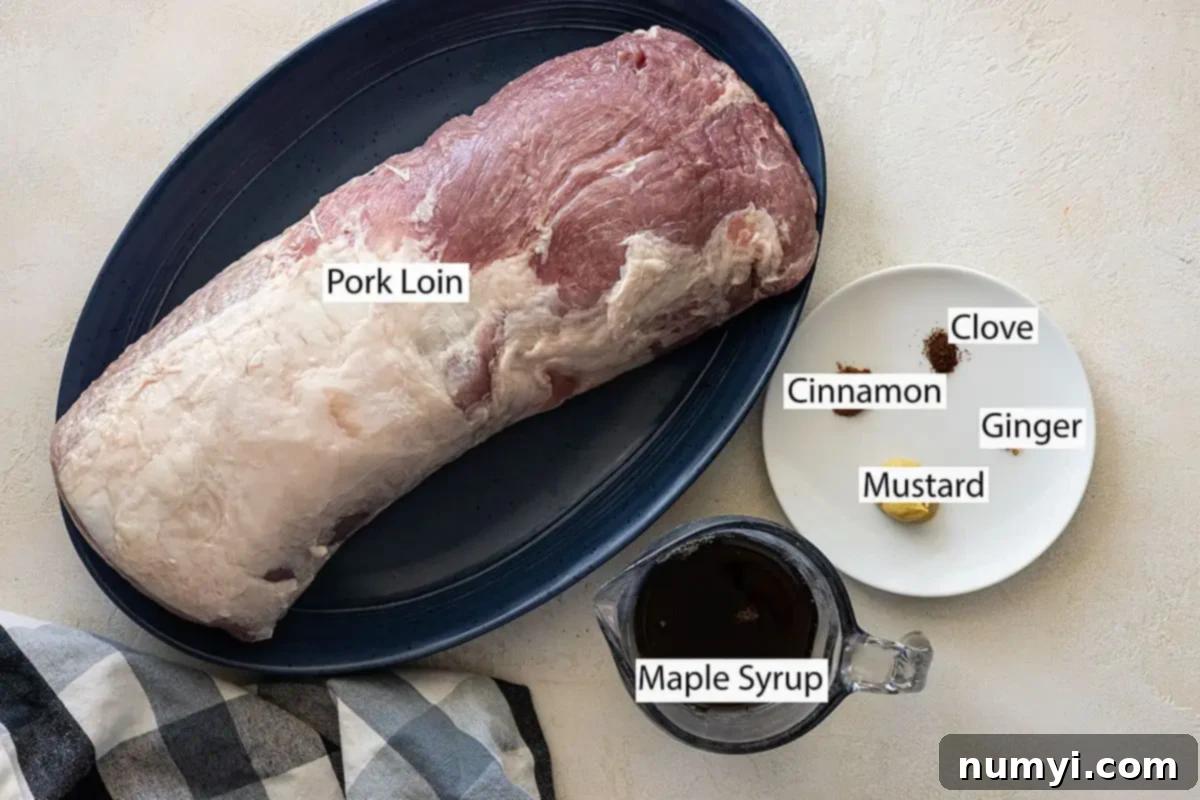 Key ingredients for maple glazed pork: pork loin, cinnamon, clove, ginger, Dijon mustard, and a bottle of pure maple syrup.