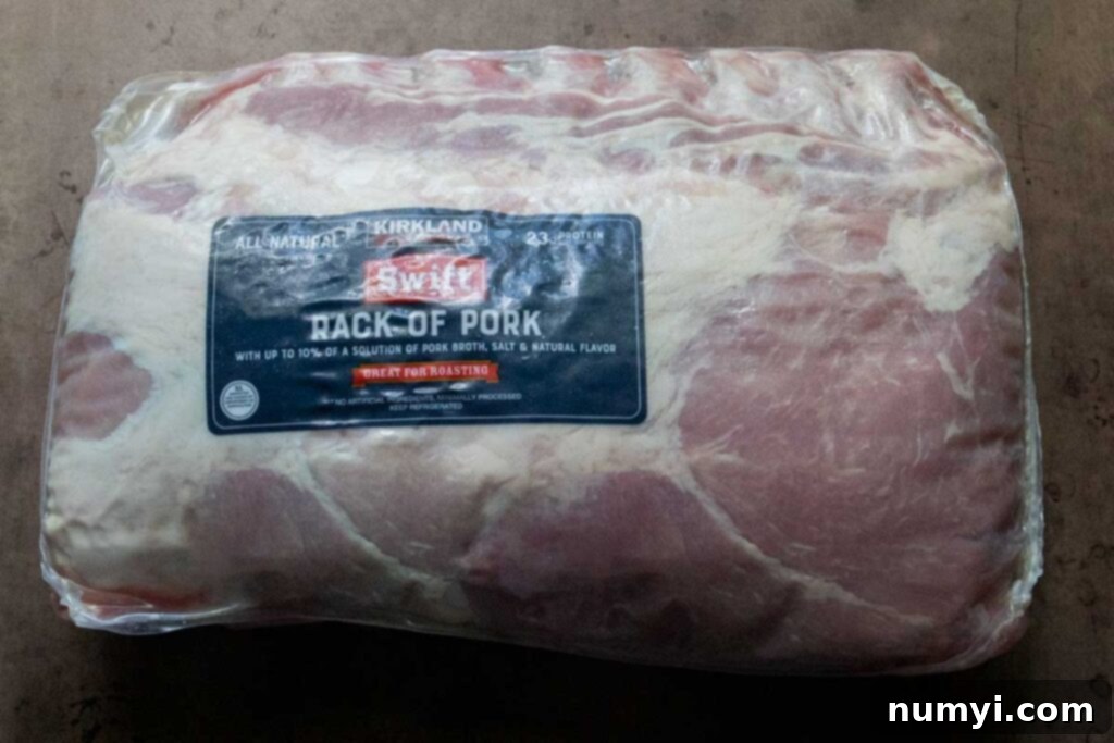 Smoked Porterhouse Pork Chops 4 An entire rack of pork in its original packaging, ready for preparation.