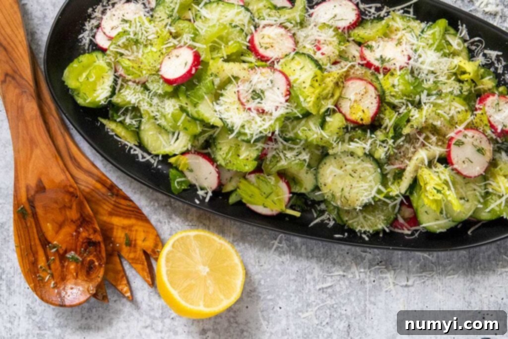 Cucumber radish salad on a black platter.