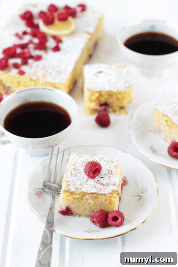 Zesty Lemon Raspberry Coffee Cake 5 mugs of coffee served with slices of lemon raspberry coffee cake