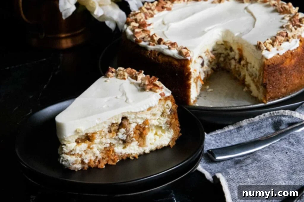 A beautiful, individual slice of carrot cake cheesecake on a sleek black plate, revealing the perfect layers of spiced cake, creamy cheesecake, and a delicate frosting topping.