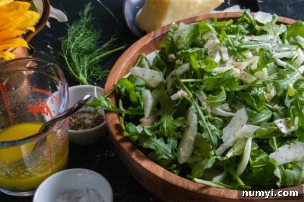 Bright Arugula Fennel Salad 3 arugula fennel salad in a wooden bowl