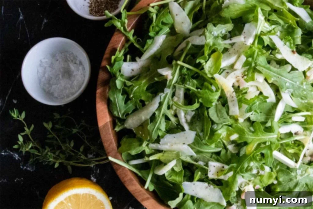 Bright Arugula Fennel Salad 6 salad in wooden bowl