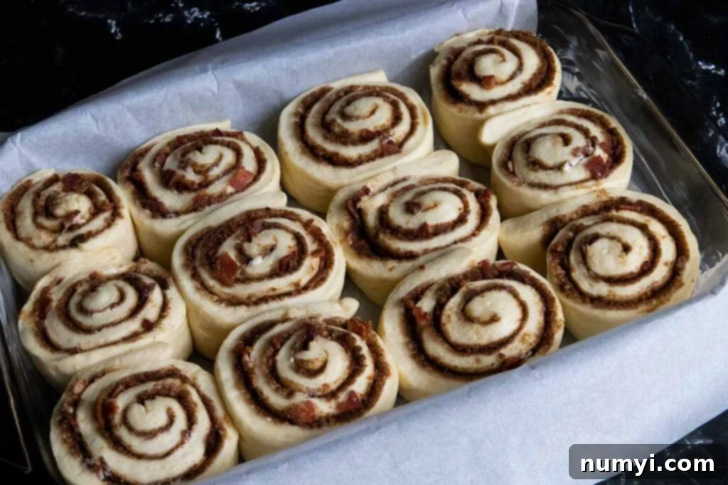 Proofed Maple Bacon Cinnamon Rolls, plump and ready for baking.
