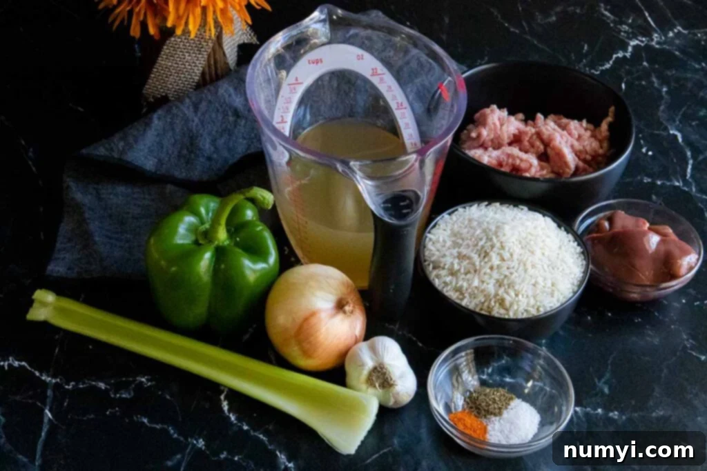 Array of fresh ingredients for Cajun dirty rice, including ground pork, chicken livers, celery, onion, bell pepper, and spices, meticulously laid out on a wooden cutting board, ready for preparation.
