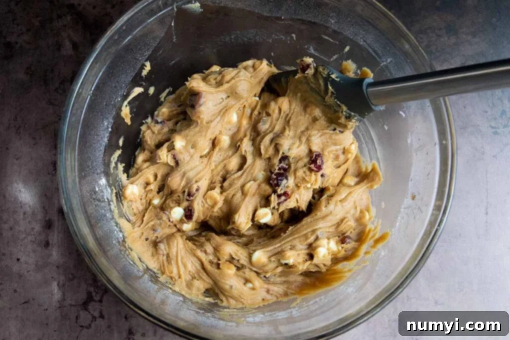 Dough in a glass mixing bowl.