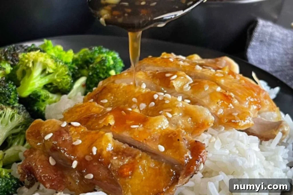 Mouthwatering Golden Crispy Teriyaki Thighs 2 Chicken Teriyaki with rice and broccoli.