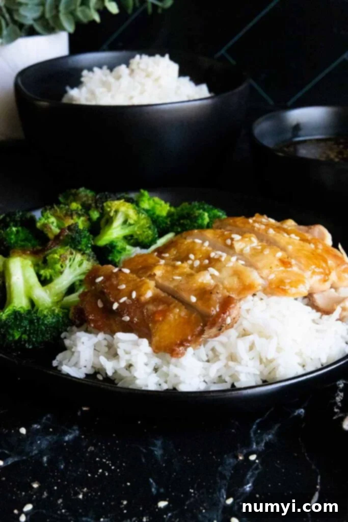 Mouthwatering Golden Crispy Teriyaki Thighs 11 Crispy chicken teriyaki thighs on a bed of rice with broccoli