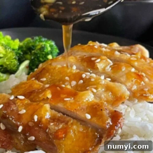 Mouthwatering Golden Crispy Teriyaki Thighs 12 Chicken Teriyaki with rice and broccoli.