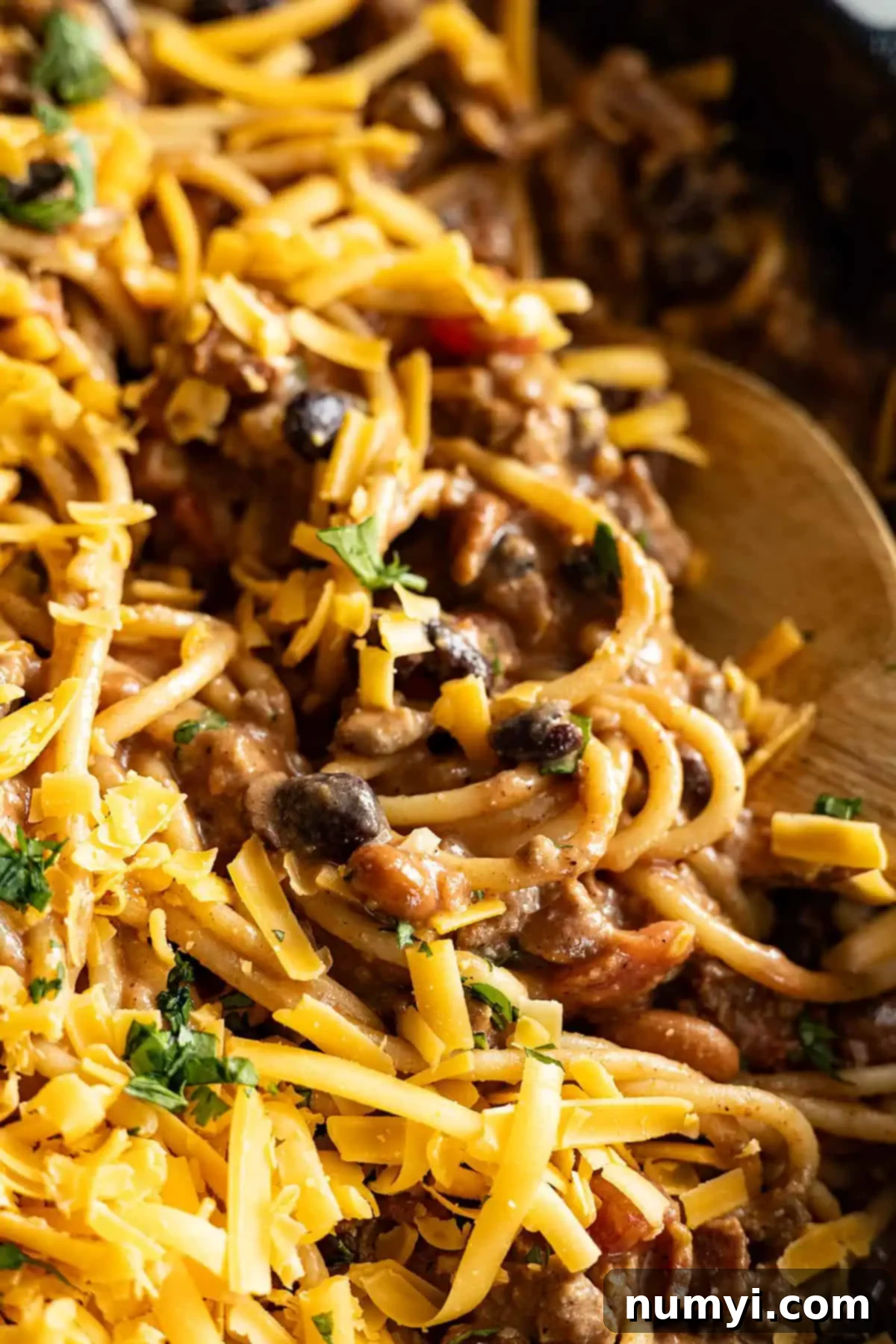 Close up of cowboy spaghetti with spoon in it. 