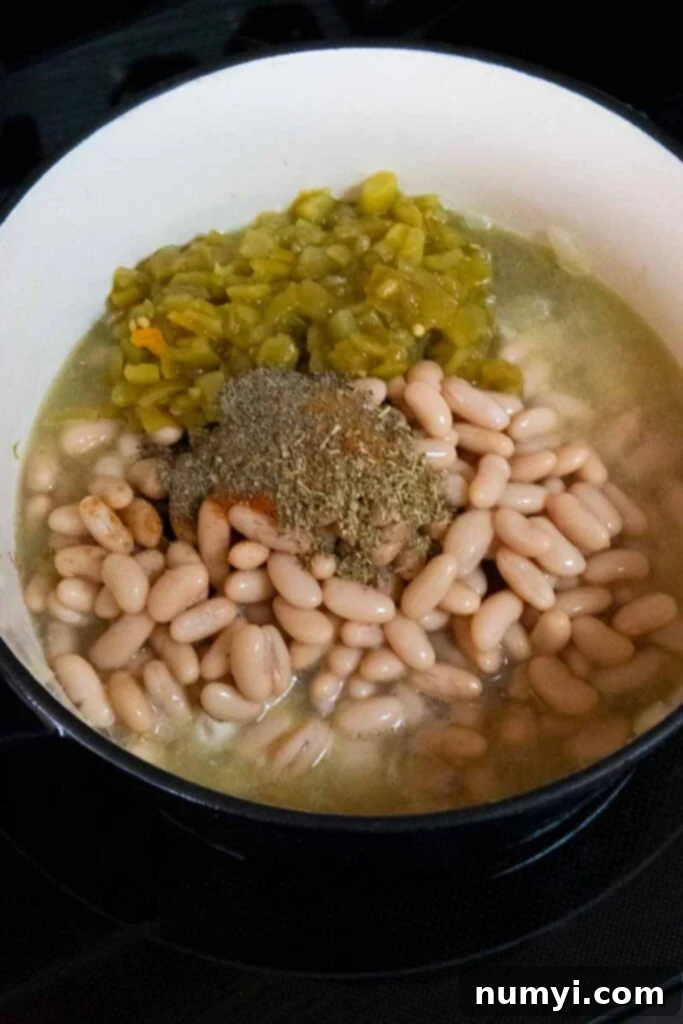 Ingredients for white chicken chili in a large dutch oven