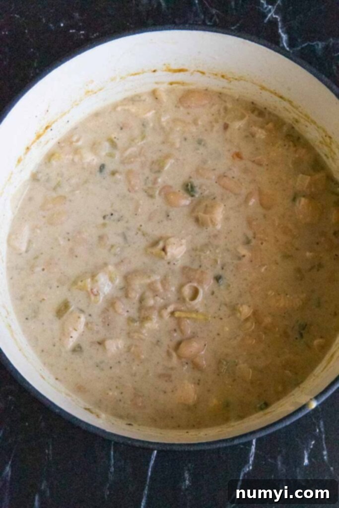 Cooked white chicken chili in a large dutch oven