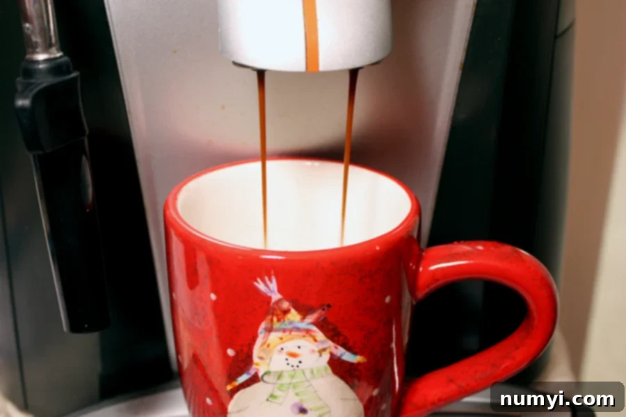 Craft Your Own Holiday Spice Flat White 7 Copycat Holiday Spice Flat White - espresso pulled into a festive red Christmas mug, ready for milk.