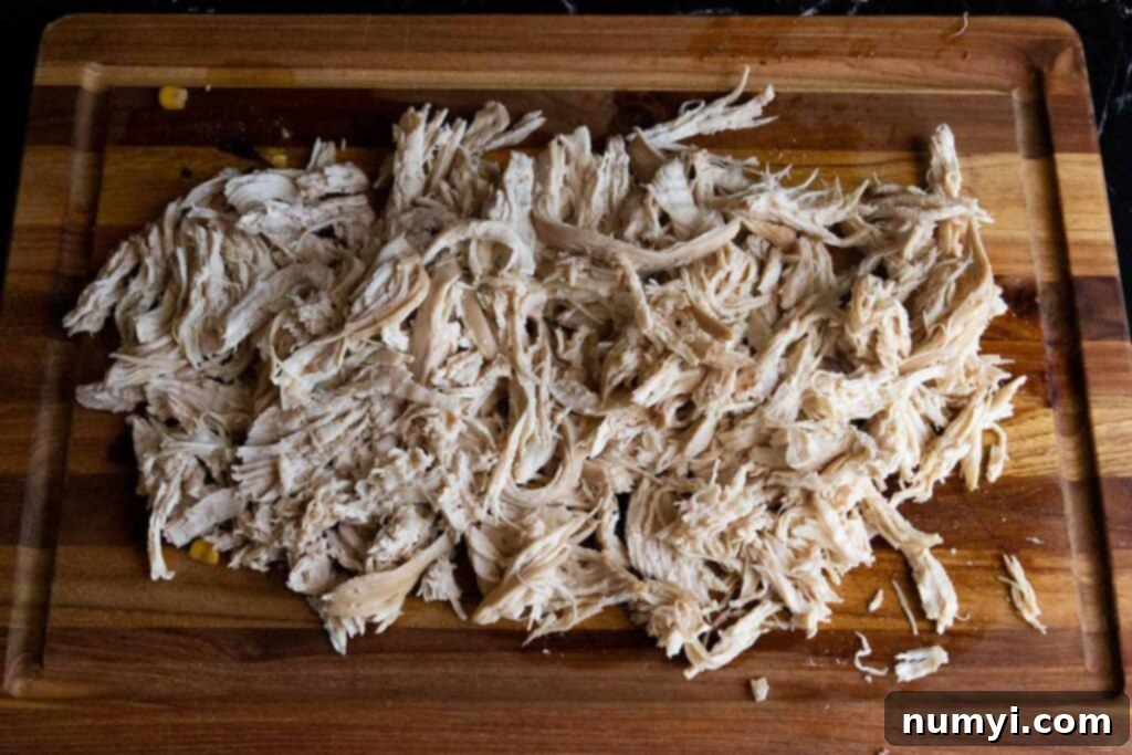 Stovetop Chicken Tortilla Soup 5 shredded chicken on a cutting board