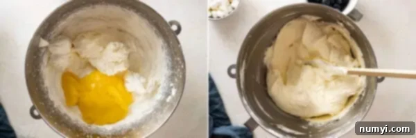 Cream cheese and lemon curd being added to the fluff.
