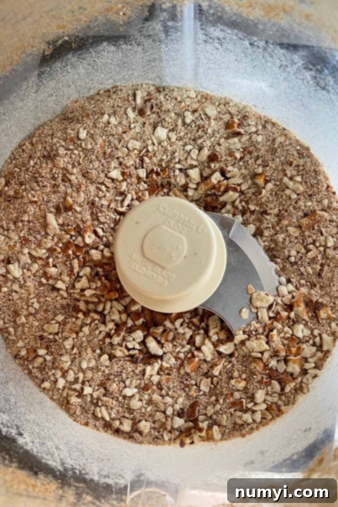 Salty Sweet Peanut Butter Pretzel Bars 4 Pretzels crushed in a food processor bowl for the no-bake bars.