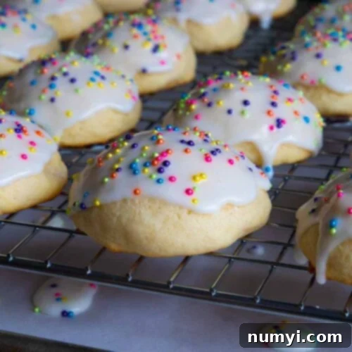 Italian ricotta cookies with glaze drying on a wire rack, ready for serving