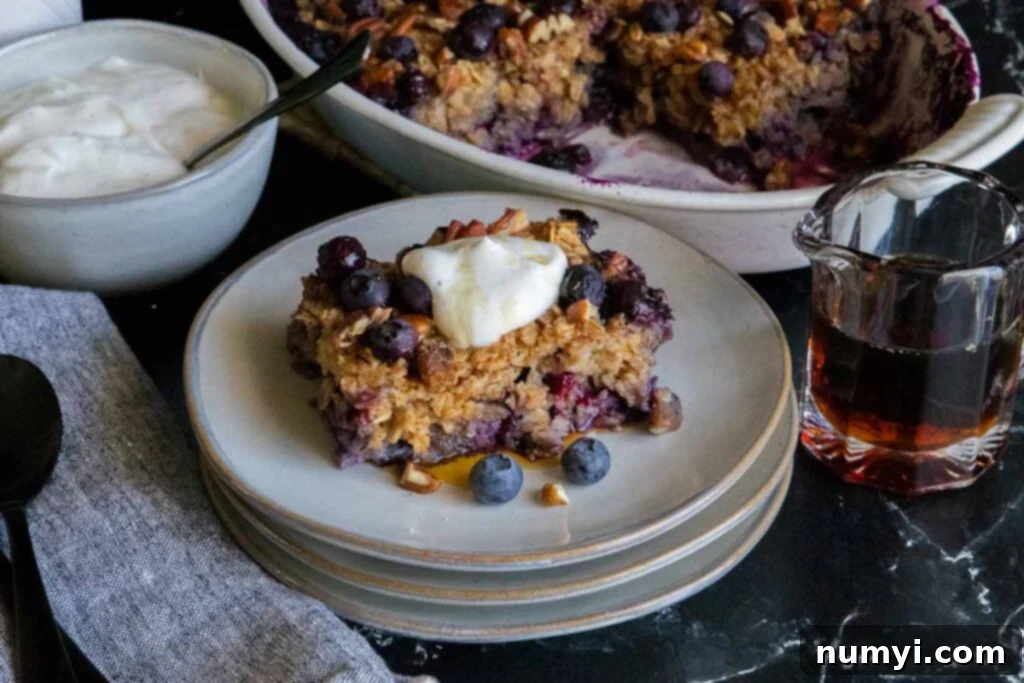 Slice of blueberry baked oatmeal on a gray plate.