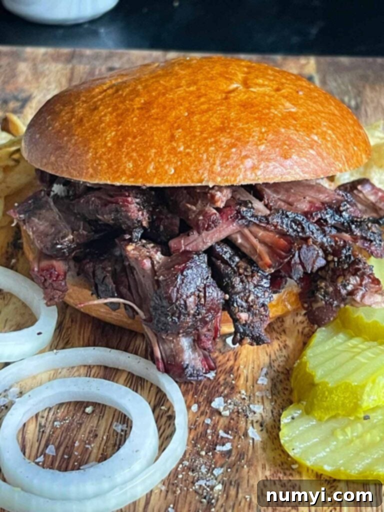 A pulled beef sandwich made from leftover smoked chuck roast.