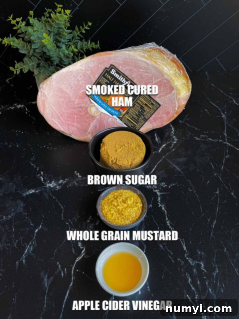 A trio of essential ingredients for the brown sugar ham glaze: dark brown sugar, whole grain mustard, and apple cider vinegar, arranged on a dark kitchen surface.