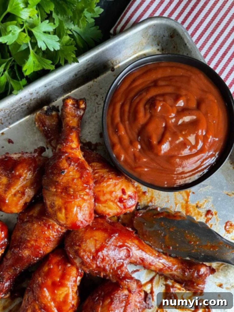 Smoky Bourbon Chipotle BBQ Sauce 8 Perfectly grilled chicken generously coated with homemade bourbon chipotle barbecue sauce, ready to serve.