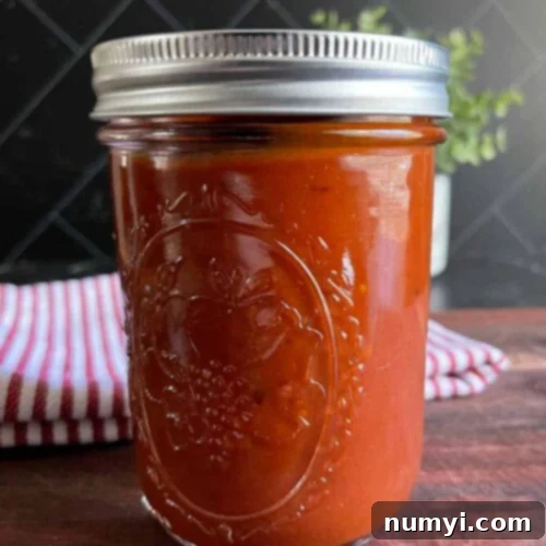 Smoky Bourbon Chipotle BBQ Sauce 9 Homemade bourbon chipotle barbeque sauce in a mason jar.
