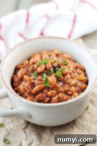 Close-up of baked beans in a white bowl